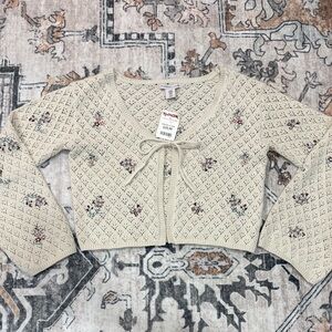 Knit cardigan with tie and flared sleeves